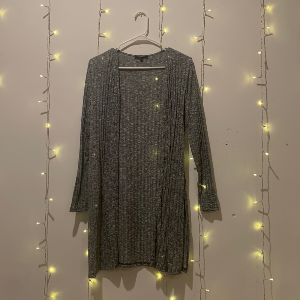 Light long heather gray sweater with slits along sides.